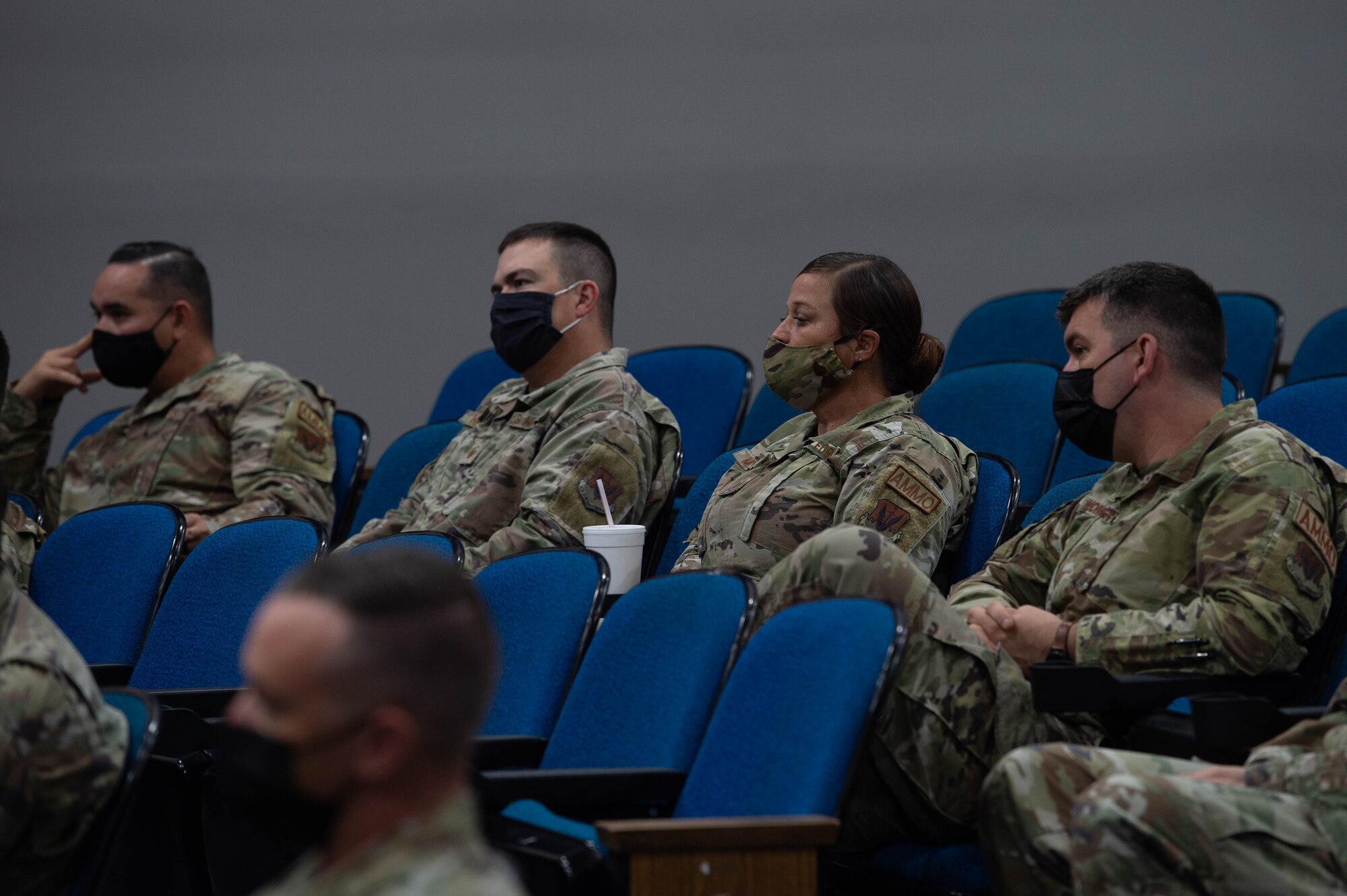 A photo of Airmen sitting.