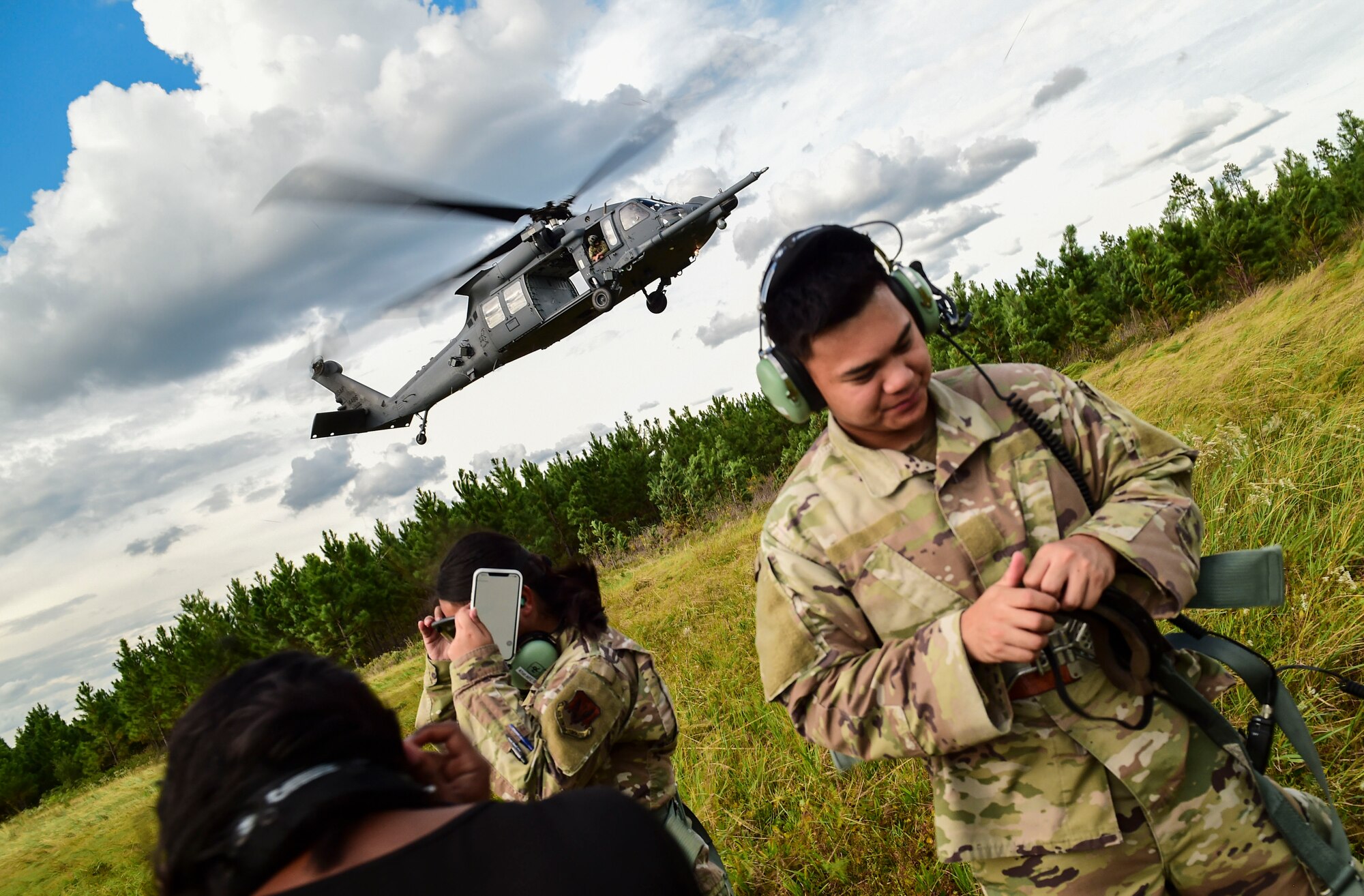 people near a helicopter landing