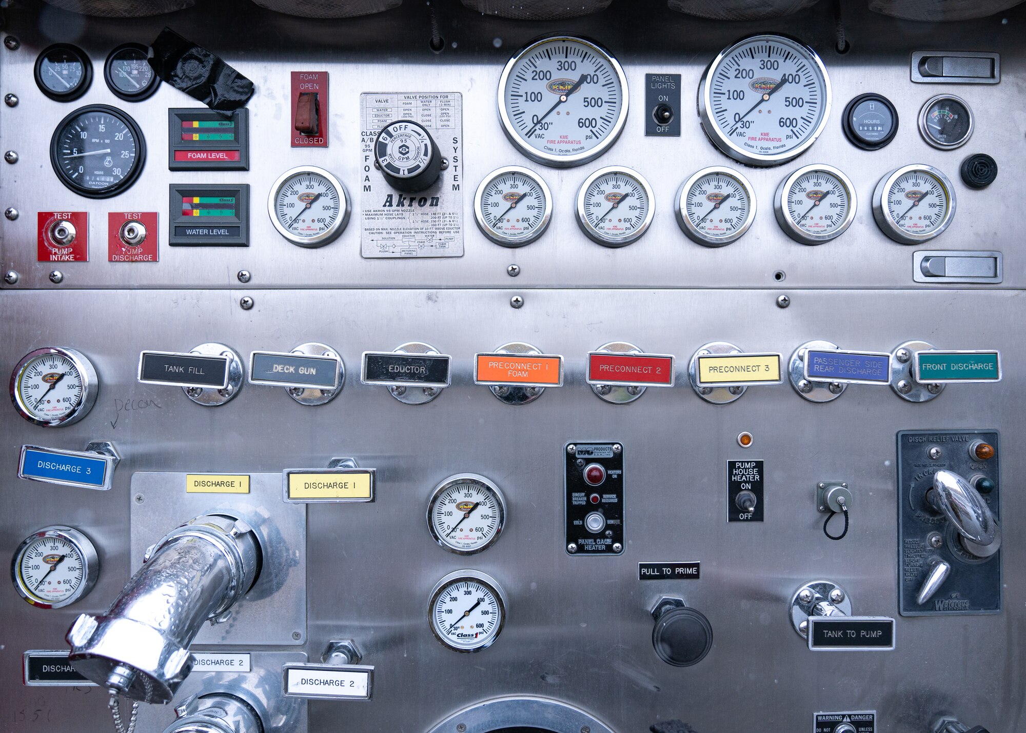 The 673d Civil Engineer Squadron displays a control panel on one of their fire engines during Fire Prevention Day.