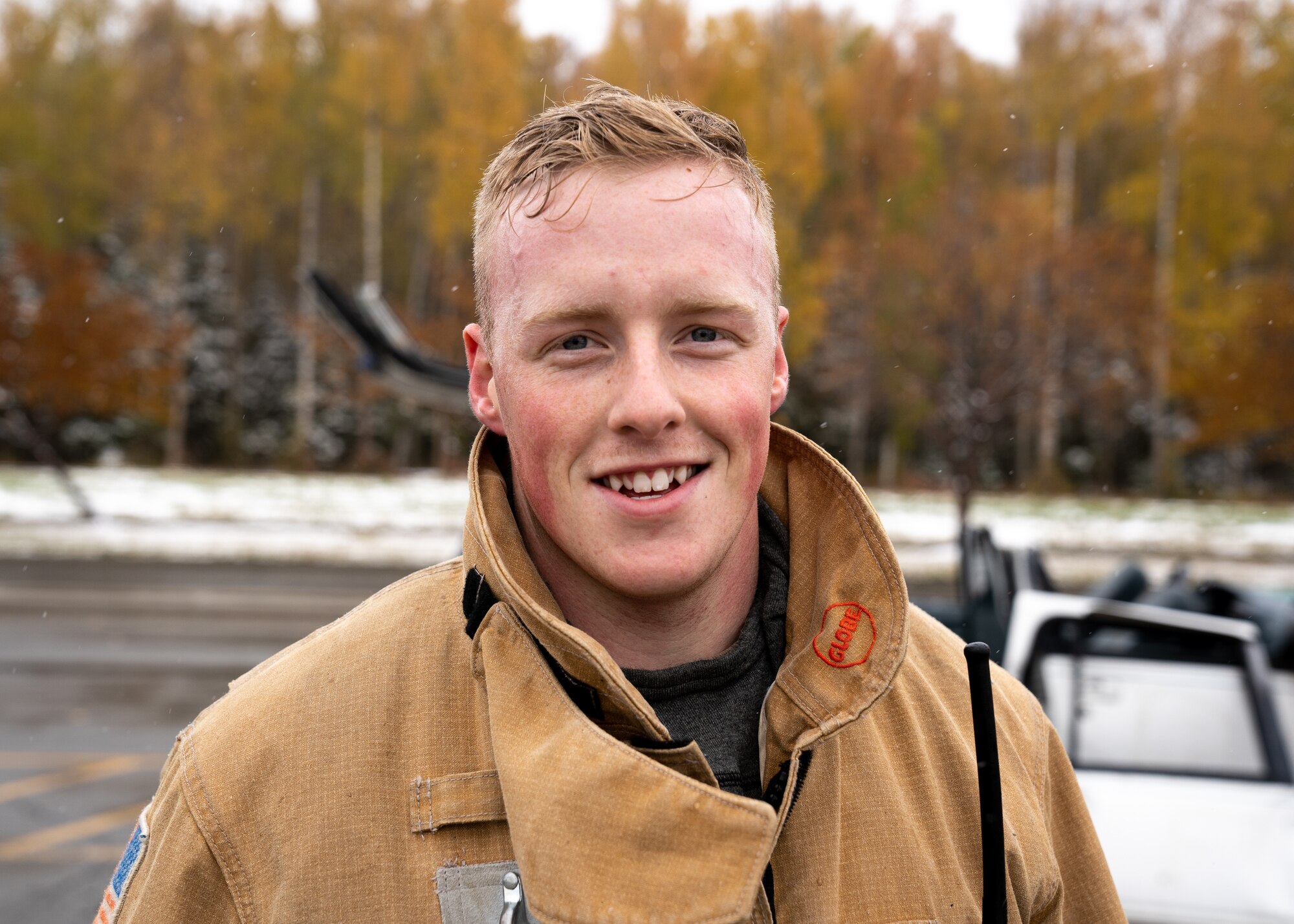 Staff Sgt. Collin Saumier, a 673d Civil Engineer Squadron fire protection supervisor, cools off after a vehicle-extrication demonstration during Fire Prevention Day.
