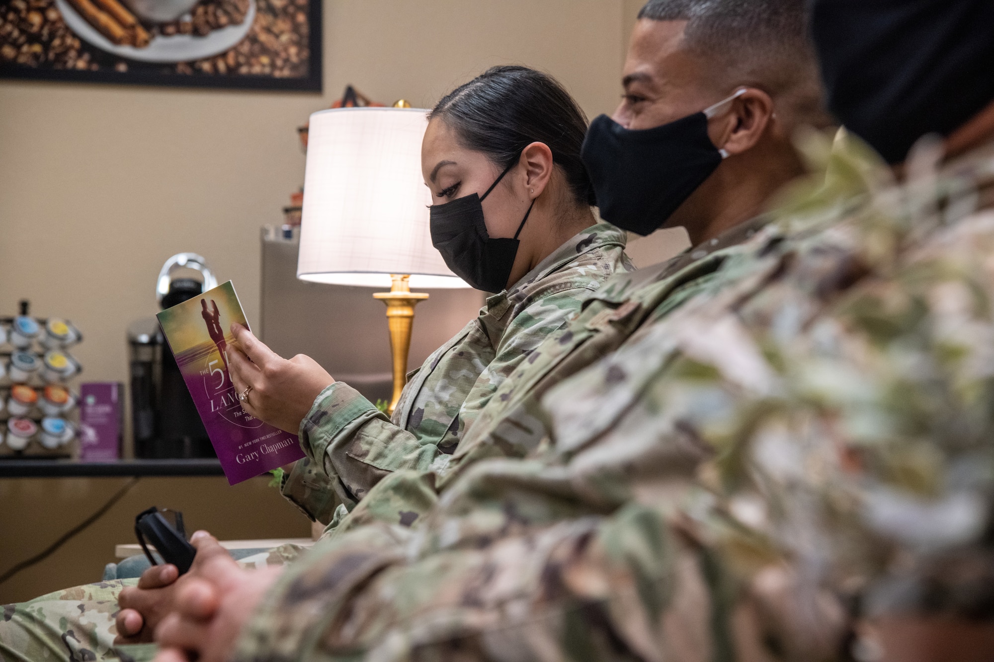 U.S. Air Force Staff Sgt. Kasandra Duran, 372nd Training Squadron Detachment 12 F-35A Lightning II weapons instructor, reads a book while using the Detachment 12 wellness room Sept. 21, 2021, at Luke Air Force Base, Arizona. The wellness room comes equipped with a coffee bar, snacks, beverages and books to create a comfortable environment Airmen can use. The newly revived wellness room helps support Airmen and their families by enhancing facilities and equipment to support combat-ready Airmen. (U.S. Air Force photo by Staff Sgt. Collette Brooks)