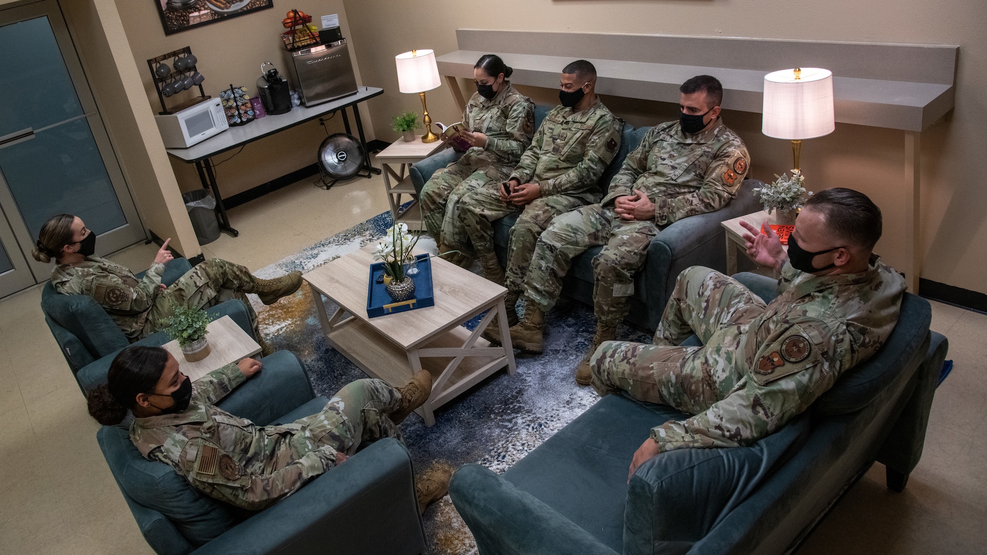 Airmen with the 372nd Training Squadron and 56th Fighter Wing use the Detachment 12 wellness room Sept. 21, 2021, at Luke Air Force Base, Arizona. The wellness room, equipped with a TV, books, paintings and snacks, was created to offer a relaxing space where members can rest, read or study. The newly revived wellness room helps support Airmen and their families by enhancing facilities and equipment to support combat-ready Airmen. (U.S. Air Force photo by Staff Sgt. Collette Brooks)