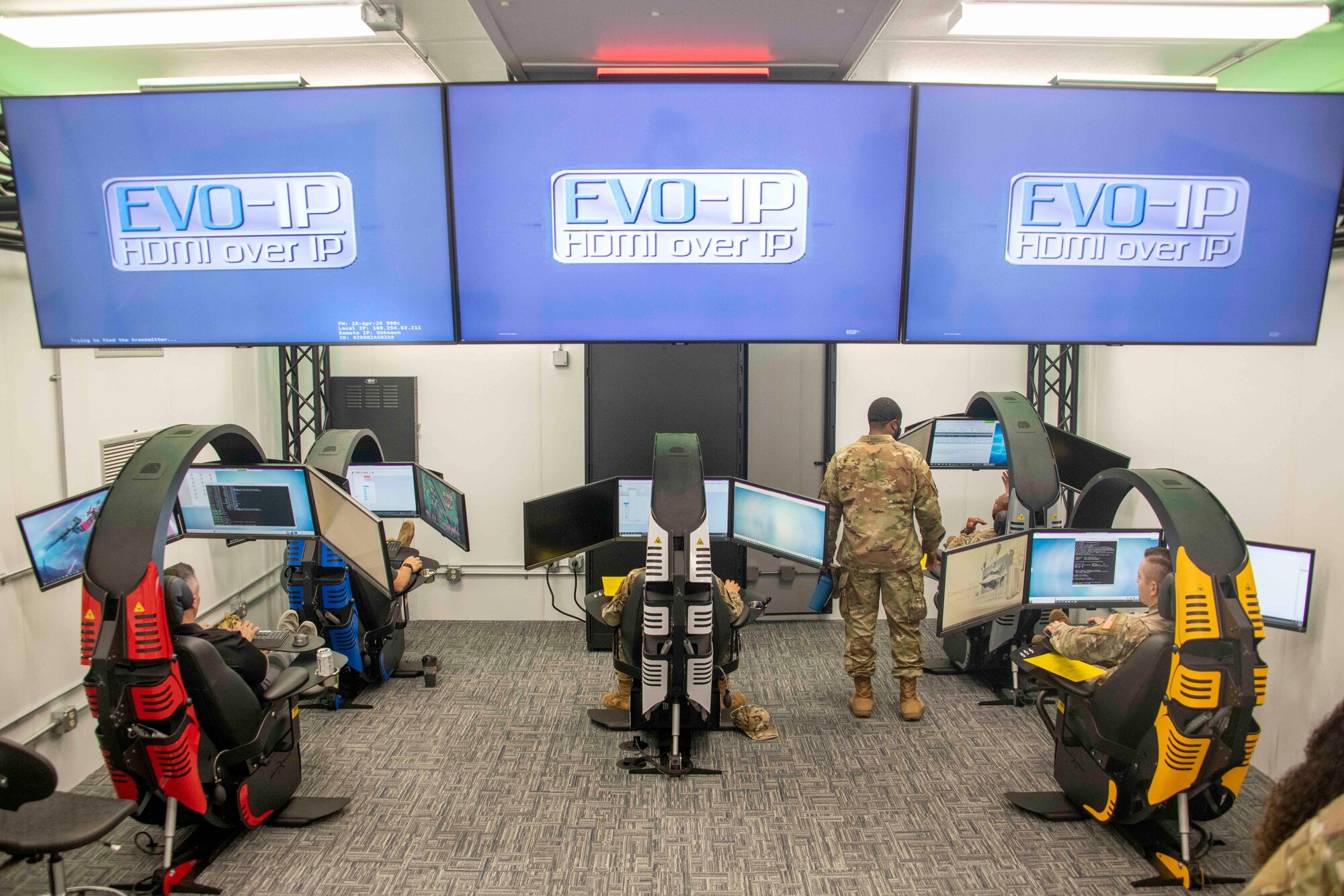 Members of the 97th Communications Squadron Mission Defense Team (MDT) prepare themselves in their range for their first cyber defense exercise at Altus Air Force Base, Oklahoma, Sept. 30, 2021. This exercise was made possible by the local finished range, which is comprised of five high-performance computer stations capable of running multiple cyber defense scripts at once. (U.S. Air Force photo by Staff Sgt. Cody Dowell)