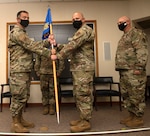 Col. David Lands, 192nd Mission Support Group commander, left, presents the 203rd Rapid Engineer Deployable Heavy Operational Repair Squadron Engineers (RED HORSE) guidon to Maj. Ayad M. Abisaab signifying the start of his command during a change of command ceremony Oct. 2, 2021, at State Military Reservation in Virginia Beach, Virginia.