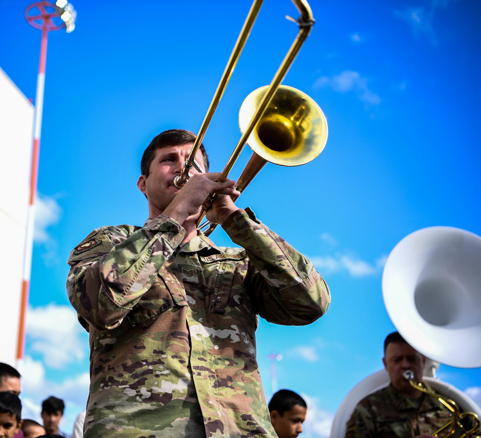 Airman play the trombone.