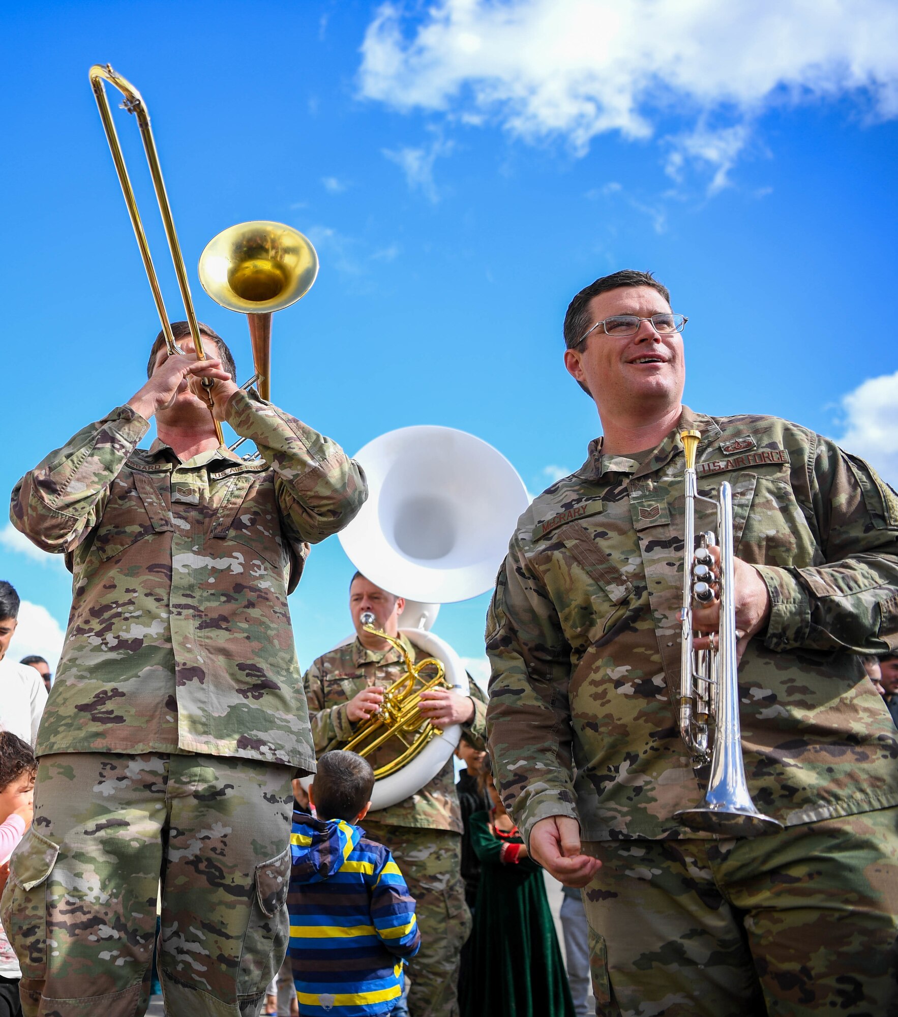 Airmen play instruments.