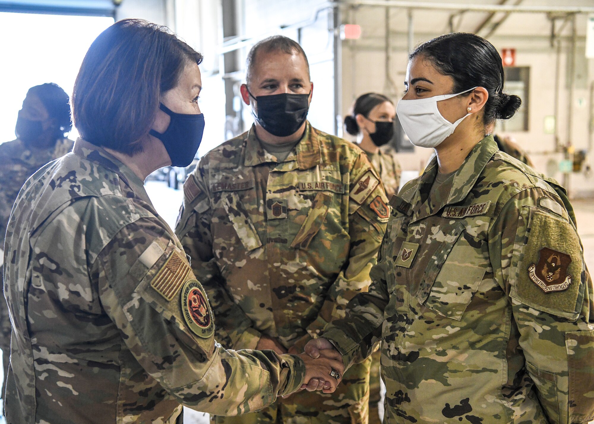 Tech. Sgt. Marcela Itah, 89th Airlift Squadron squadron aviation resource management technician, is coined by Chief Master Sgt. of the Air Force JoAnne Bass Oct. 2, 2021, for being an exceptional performer in her unit. In addition to her dedicated service on a daily basis, Itah volunteered for a deployment to Ramstein Air Base, Germany, where she was lauded by the 10th Expeditionary Aeromedical Evacuation Flight commander for outstanding performance and was named “721st Mobility Support Squadron Exceptional Performer of the Month.”  Itah was also recently recognized for saving the life of an Ohio Air National Guard Airman who had posted a suicide note on social media.  Her quick and decisive action was directly responsible for prompt intervention before the Airman could act on his intentions. 

Three Airmen from the 445th Airlift Wing were coined for being outstanding performers for their respective units.