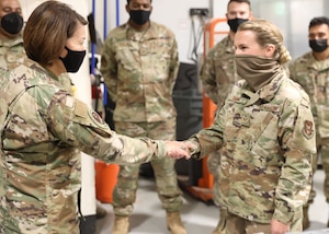 Staff Sgt. Leslie Smith, 445th Maintenance Squadron non-destructive inspection journeyman, is coined by Chief Master Sgt. of the Air Force JoAnne Bass Oct. 2, 2021, for being an exceptional performer in her unit.