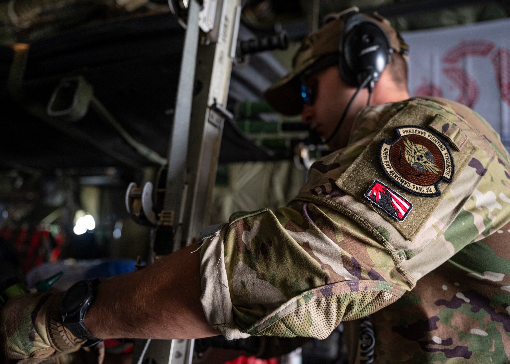 Air Force Staff Sgt. Robert Perry, an Aeromedical Evacuation Technician assigned to the 405th Expeditionary Aeromedical Evacuation Squadron, secures medical equipment on a C-130H Hercules at Ali Al Salem Air Base, Kuwait, Oct. 1, 2021.