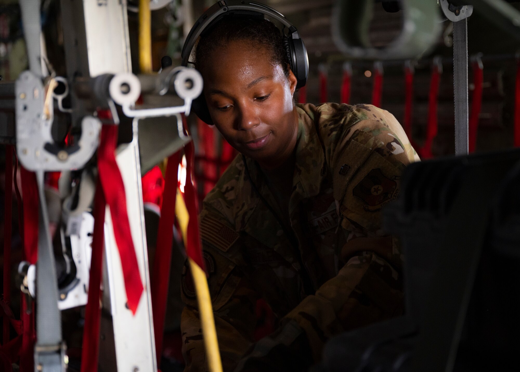 Senior Master Sgt. Maila Butler, an Aeromedical Evacuation Technician assigned to the 405th Expeditionary Aeromedical Evacuation Squadron, secures medical equipment on a C-130H Hercules at Ali Al Salem Air Base, Kuwait, Oct. 1, 2021.