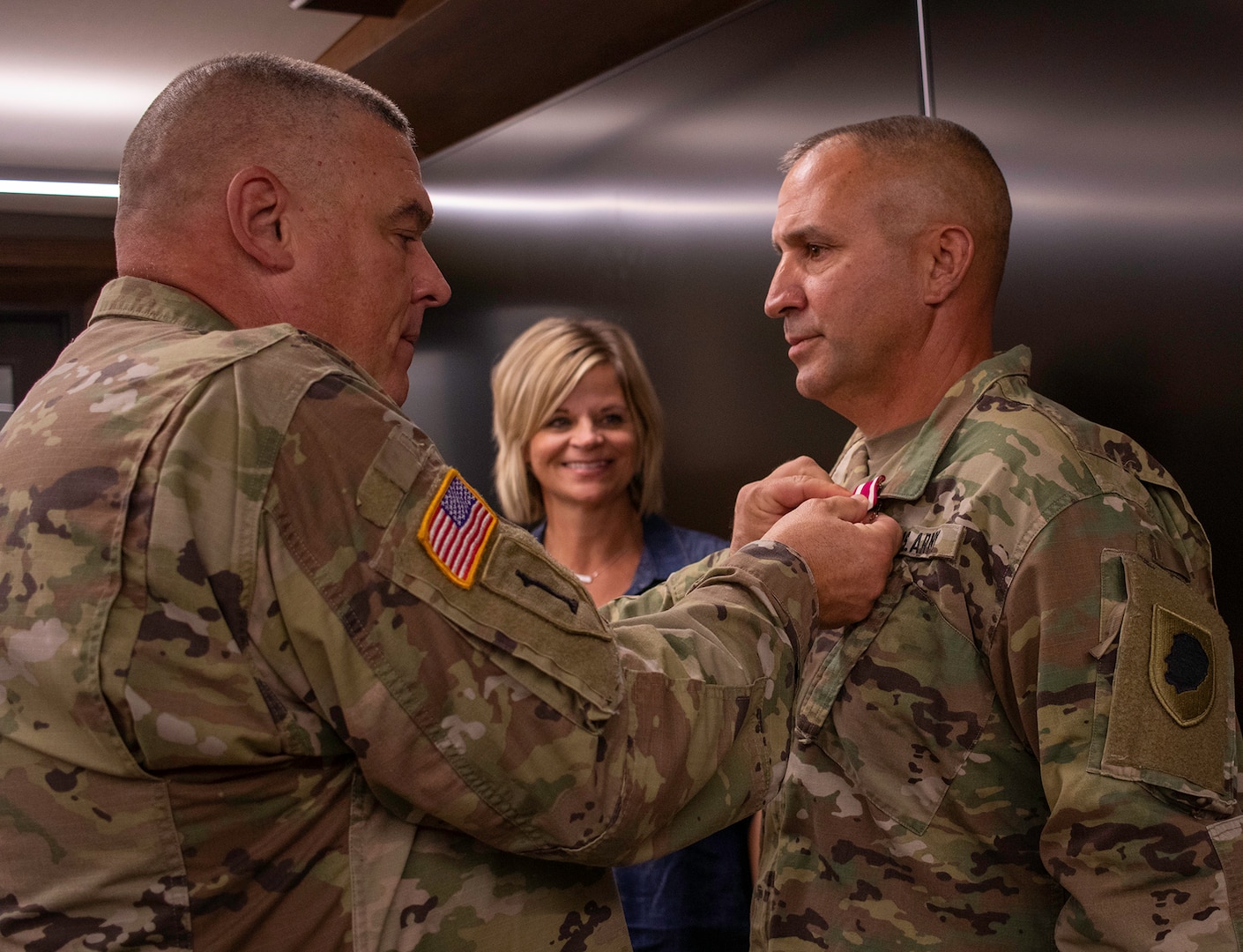 Lt. Col. Roger “Mike” Landon, right, of Petersburg, Illinois, receives a Meritorious Service Medal, from Col. Brian Creech, of Petersburg, Illinois, U.S. Property and Fiscal Officer for Illinois, during his retirement ceremony Sept. 30 at Joint Force Headquarters, Camp Lincoln, Springfield, Illinois.