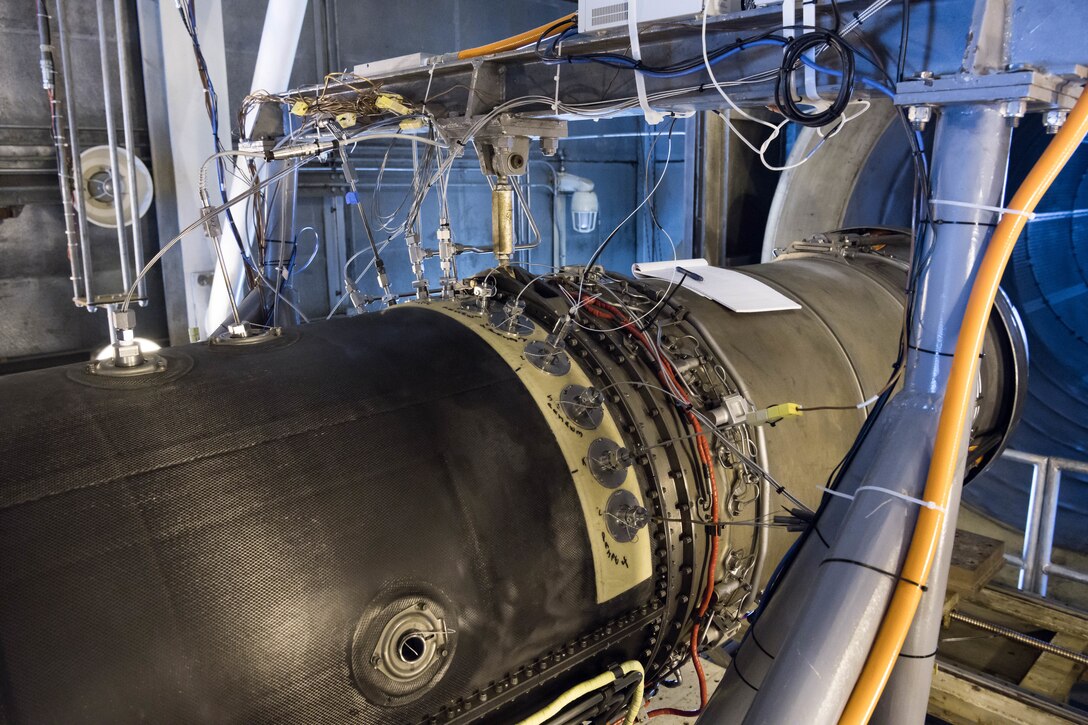 Instrumentation is connected to the General Electric F404 engine installed in the Arnold Engineering Development Complex Sea Level Test Cell 1 for testing in support of the Engine Life Extension and Health Monitoring program on June 15, 2021, at Arnold Air Force Base, Tenn. (U.S. Air Force photo by Jill Pickett)