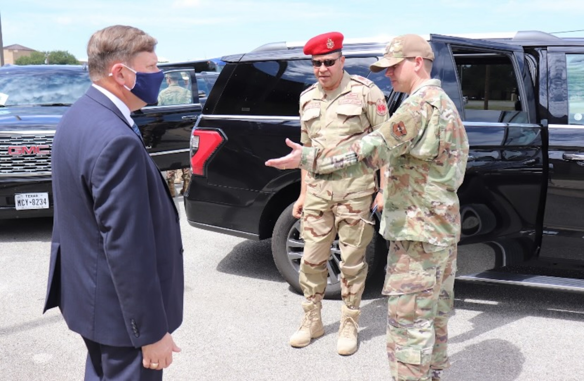 Col Wilson introduces Egyptian military member to George Gagnon at IAAFA