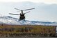 U.S. Army paratroopers assigned to the 4th Infantry Brigade Combat Team (Airborne), 25th Infantry Division, U.S. Army Alaska, wait for a CH-47 Chinook.