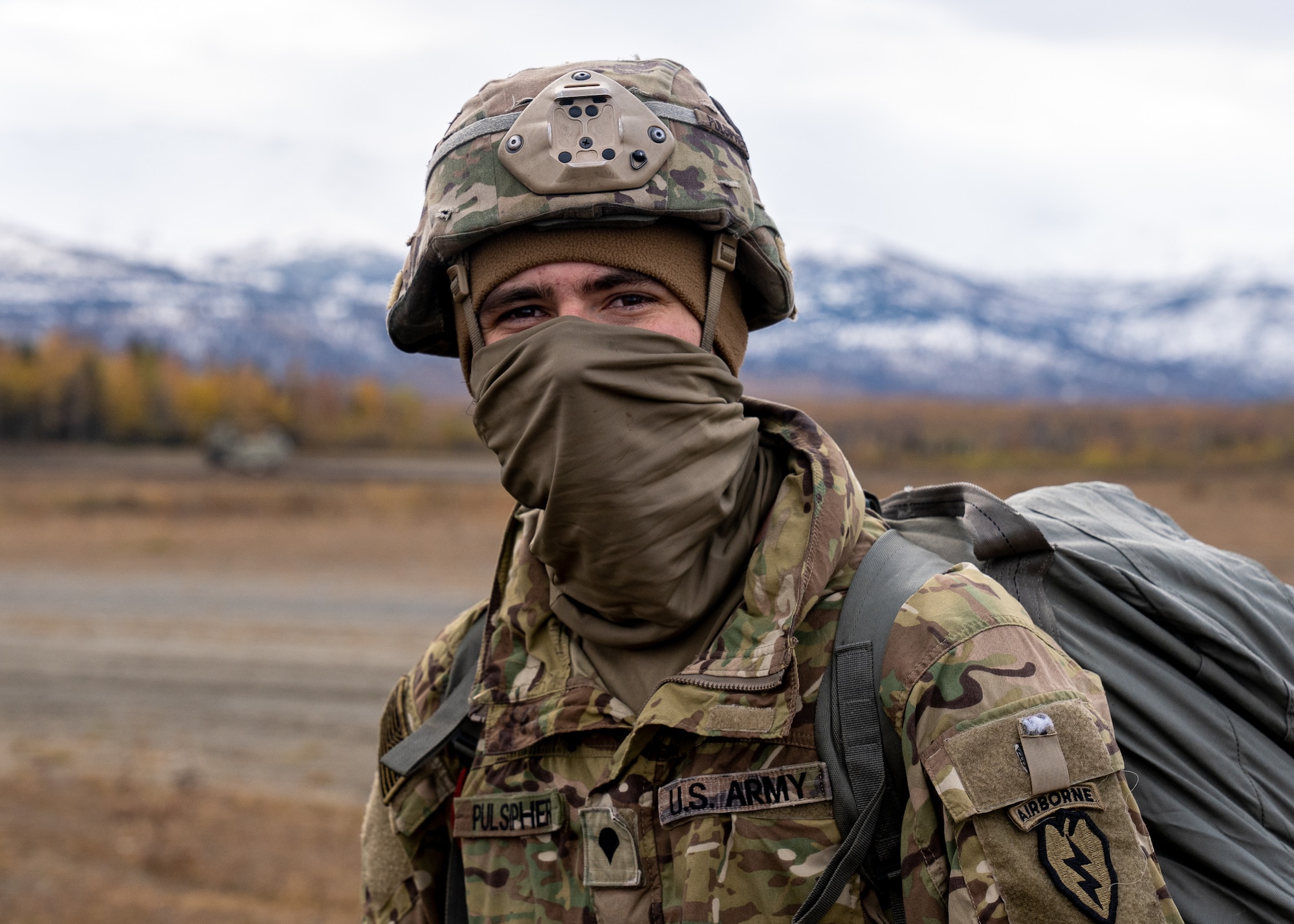 U.S. Army Spc. Chris Pulsipher, a paratrooper assigned to the 1st Squadron (Airborne), 40th Cavalry Regiment, 4th Infantry Brigade Combat Team (Airborne), 25th Infantry Division, U.S. Army Alaska, smiles after successfully jumping from a CH-47 Chinook.