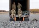 U.S. Army paratroopers assigned to the 4th Infantry Brigade Combat Team (Airborne), 25th Infantry Division, U.S. Army Alaska, manage parachutes after a series of jumps from a CH-47 Chinook.