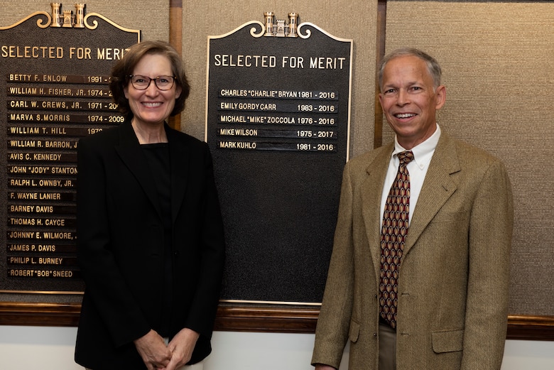 Mark Kuhlo, 2021 Distinguished Civilian Employee Recognition Award recipient, poses with his wife Jeanne by a nameplate on a bronze plaque highlighting his recognition Oct. 6, 2021 at the Nashville District Headquarters in Nashville, Tennessee. Kuhlo retired in 2016 following 35 years of federal service, culminating his career as chief of the Electrical and Mechanical Branch. (USACE Photo by Lee Roberts)