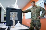 Alaska Air National Guard Airman 1st Class Shawn McDermott, an aircraft metals technician with the 176th Maintenance Squadron Fabrication Flight, operates a consumer-grade 3D printer Sept. 28, 2021, at Joint Base Elmendorf-Richardson’s Arctic Spark Innovation Lab. In the course of his regular duties, McDermott operates industrial-grade 3D printers to fabricate parts for 176th Wing’s aircraft.