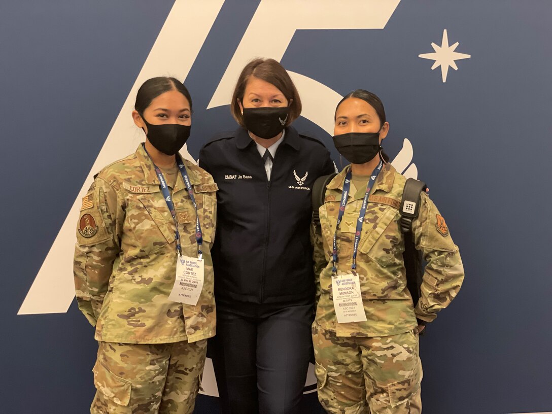 Senior Airman Mae Cortez (left), a Physical Therapy Technician with the 90th Operational Medical Readiness Squadron, Chief Master Sergeant of the Air Force JoAnne S. Bass (center), and Airman 1st Class Rendora Munson, a Financial Operations Technician with the 90th Comptroller Squadron, pose for a picture at the Air Force Association's 2021 Air, Space and Cyber Conference. The conference featured many speakers who spoke on the theme of this years conference; "air and space leadership for our nation: today and tomorrow."