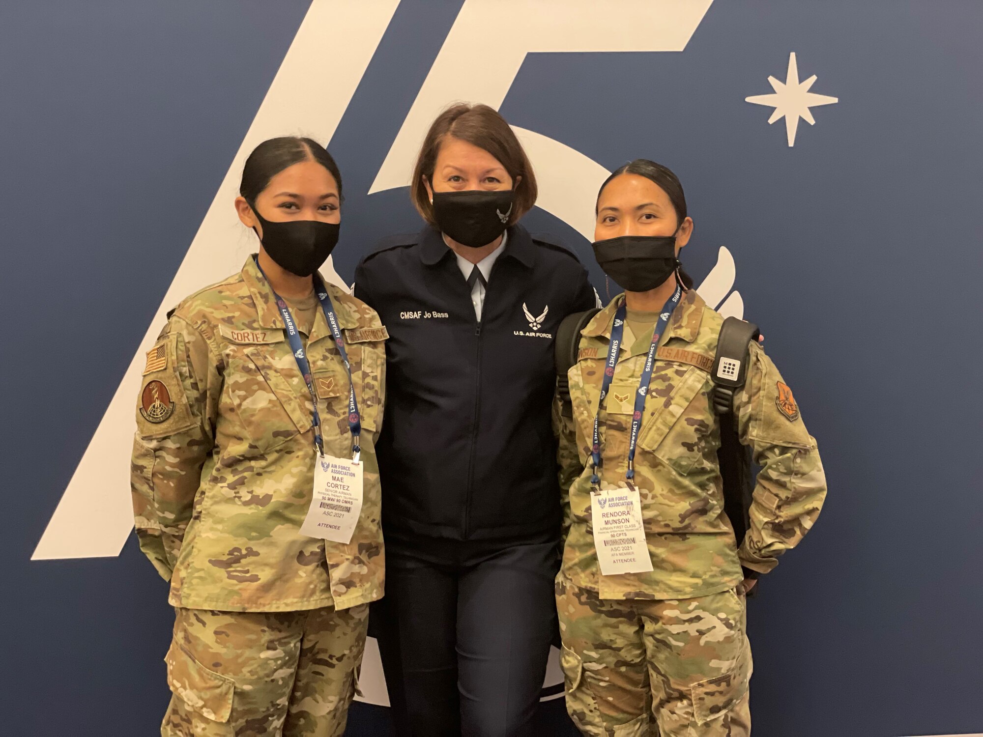 Senior Airman Mae Cortez (left), a Physical Therapy Technician with the 90th Operational Medical Readiness Squadron, Chief Master Sergeant of the Air Force JoAnne S. Bass (center), and Airman 1st Class Rendora Munson, a Financial Operations Technician with the 90th Comptroller Squadron, pose for a picture at the Air Force Association's 2021 Air, Space and Cyber Conference. The conference featured many speakers who spoke on the theme of this years conference; "air and space leadership for our nation: today and tomorrow."