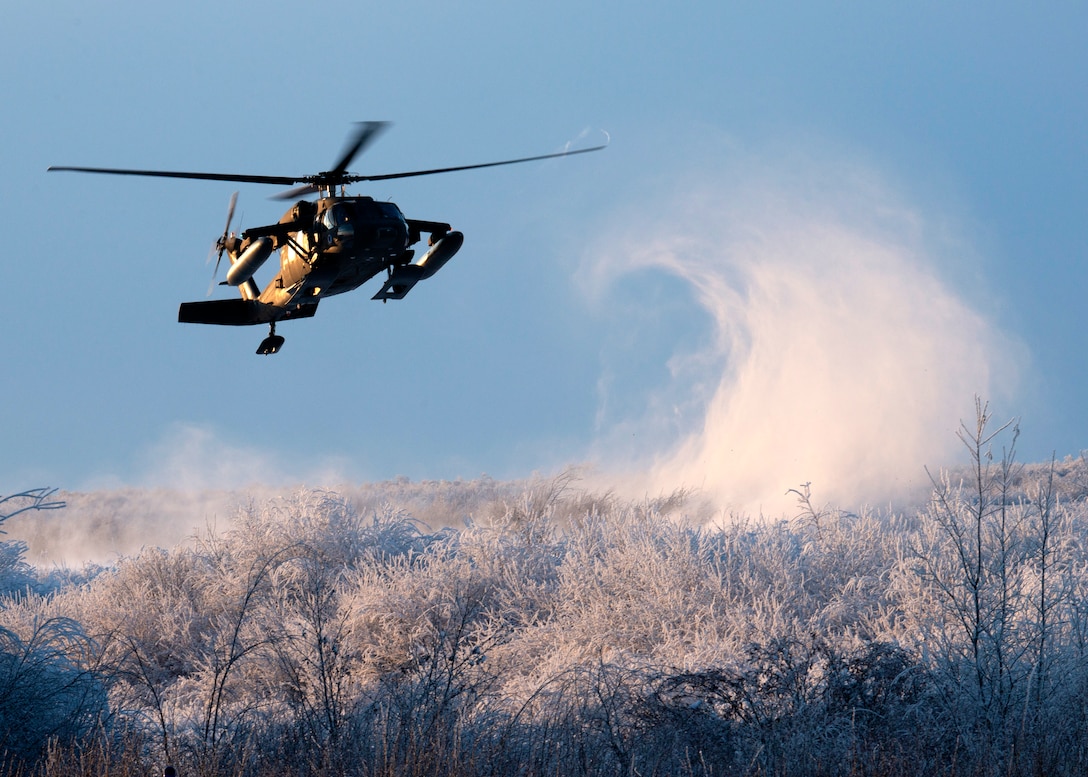 An Alaska Army National Guard UH-60 Black Hawk assigned to the National Guard Readiness Center in Bethel, Alaska, carries volunteers during Operation Santa Claus in Napakiak, Alaska, Dec. 3, 2019. Operation Santa Claus is an annual event hosted by the Alaska National Guard and the Salvation Army. The Alaska National Guard started the event in 1956 and was joined by the Salvation Army more than 40 years ago. This partnership serves as a way for the military to care for isolated villages. Napaiak is a village in western Alaska with a population of around 350 people. Volunteers flew into the village to deliver gifts, school supplies, backpacks, ice cream and an opportunity to take a photo with Santa for the entire community. (U.S. Air Force photo by Airman 1st Class Emily Farnsworth)