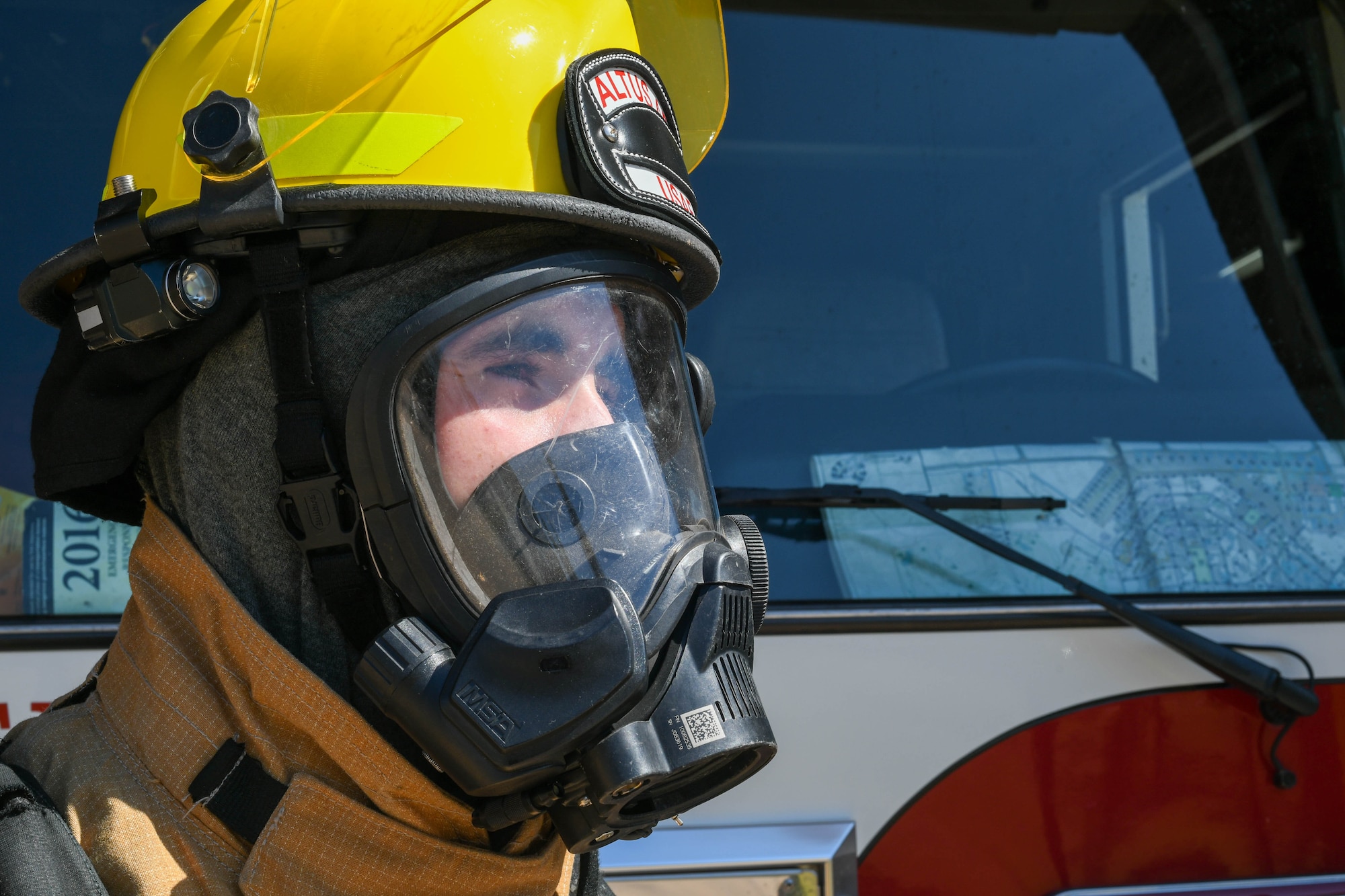 U.S. Air Force Airman 1st Class Joseph Coveney, 97th Civil Engineer Squadron (CES) fire prevention specialist, strikes a pose in front of Engine 11 at the fire department on Altus Air Force Base, Oklahoma, Oct. 4, 2021. Coveney models himself most like his uncle, a firefighter from Boston, Massachusetts. (U.S. Air Force photo by Airman 1st Class Trenton Jancze)