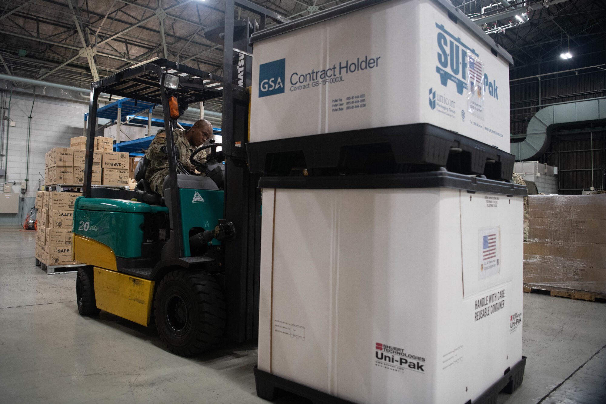 Airman operates a forklift