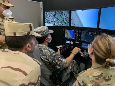 Egyptian Armed Forces member operates flight simulator