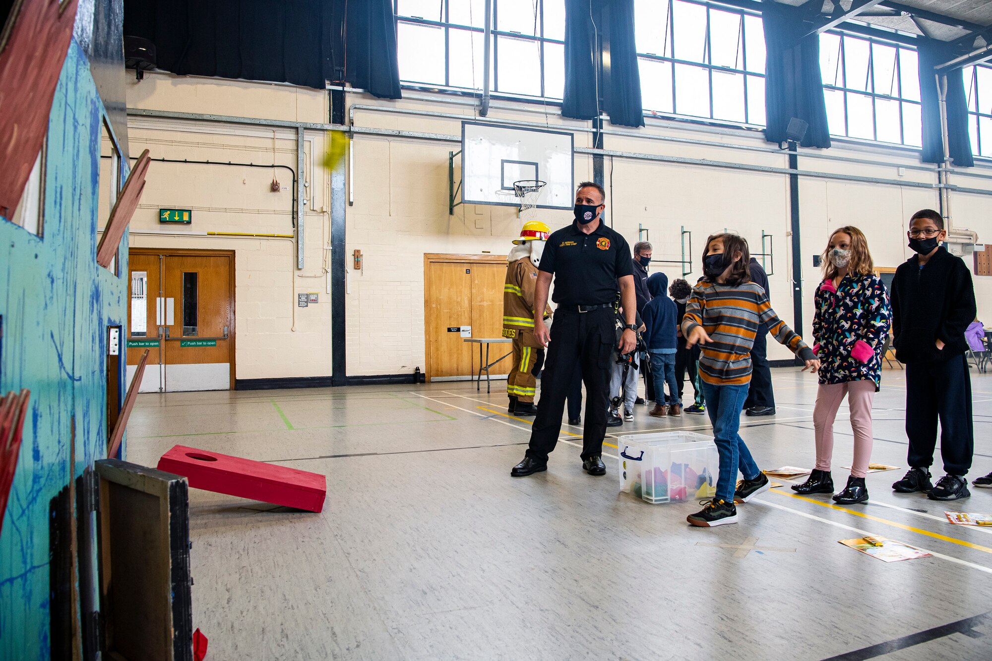 A student from Alconbury Elementary school tosses a bean bag during a fire station open house at RAF Alconbury, England, Oct. 7, 2021. The open house was a part of Fire Prevention Week which allowed firefighters from the 423rd CES to educate Airmen and family members from the 501st Combat Support Wing on proper fire safety habits. (U.S. Air Force photo by Senior Airman Eugene Oliver)