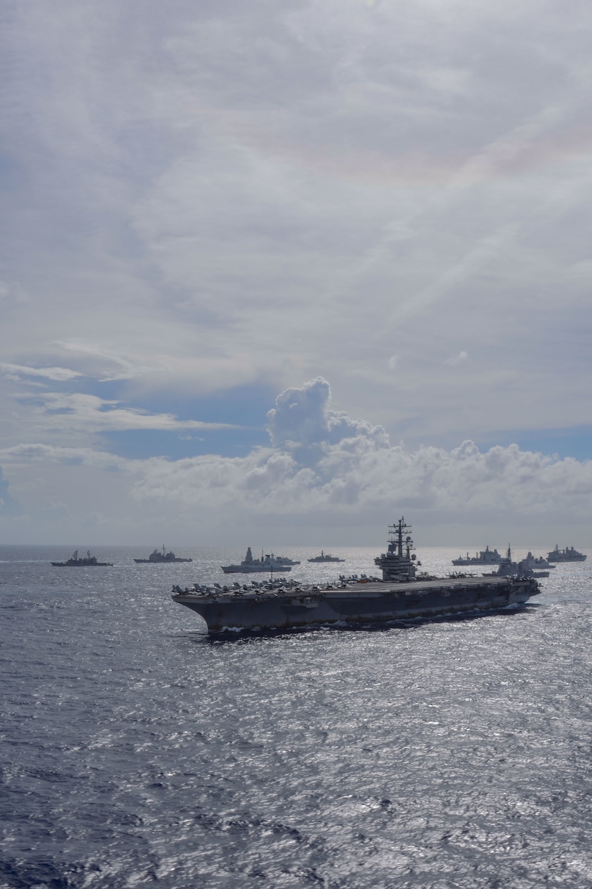 211003-N-RC359-1101 PHILIPPINE SEA (Oct. 3, 2021) The United Kingdom’s carrier strike group, led by HMS Queen Elizabeth (R 08), and the Japan Maritime Self-Defense Force (JMSDF), led by Hyuga-class helicopter destroyer JS Ise (DDH 182), joined with U.S. Navy carrier strike groups, led by flagships USS Ronald Reagan (CVN 76) and USS Carl Vinson (CVN 70), to conduct multiple carrier strike group operations in the Philippine Sea. The integrated at-sea operations brought together more than 15,000 Sailors across six nations, and demonstrates the U.S. Navy’s ability to work closely with its unmatched network of alliances and partnerships in support of a free and open Indo-Pacific. (U.S. Navy photo by Mass Communication Specialist Seaman George Cardenas)