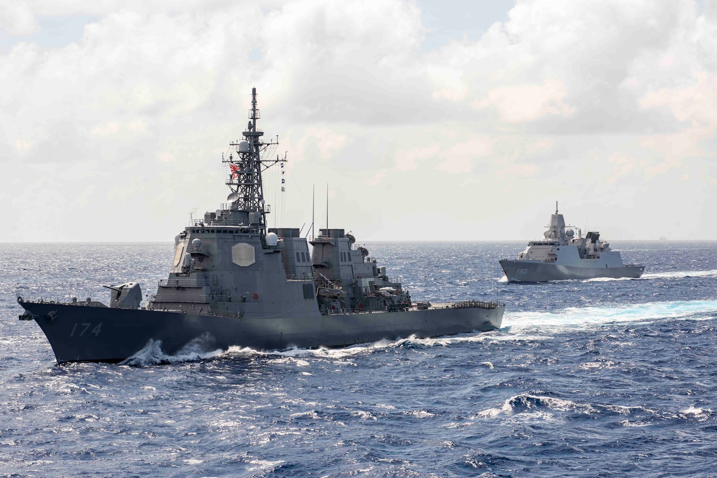 211003-N-WS494-1022 PHILIPPINE SEA (Oct. 3, 2021) From left, the Japan Maritime Self-Defense Force (JMSDF) guided-missile destroyer, JS Kirishima (DDG 174), steams alongside Netherlands navy guided-missile frigate, BEL Evertson (FFG F805), during a photo exercise with multiple carrier strike groups. The integrated at-sea operations brought together more than 15,000 Sailors across six nations, and demonstrates the U.S. Navy’s ability to work closely with its unmatched network of alliances and partnerships in support of a free and open Indo-Pacific. (Photo by Mass Communication Specialist 2nd Class Quinton A. Lee)