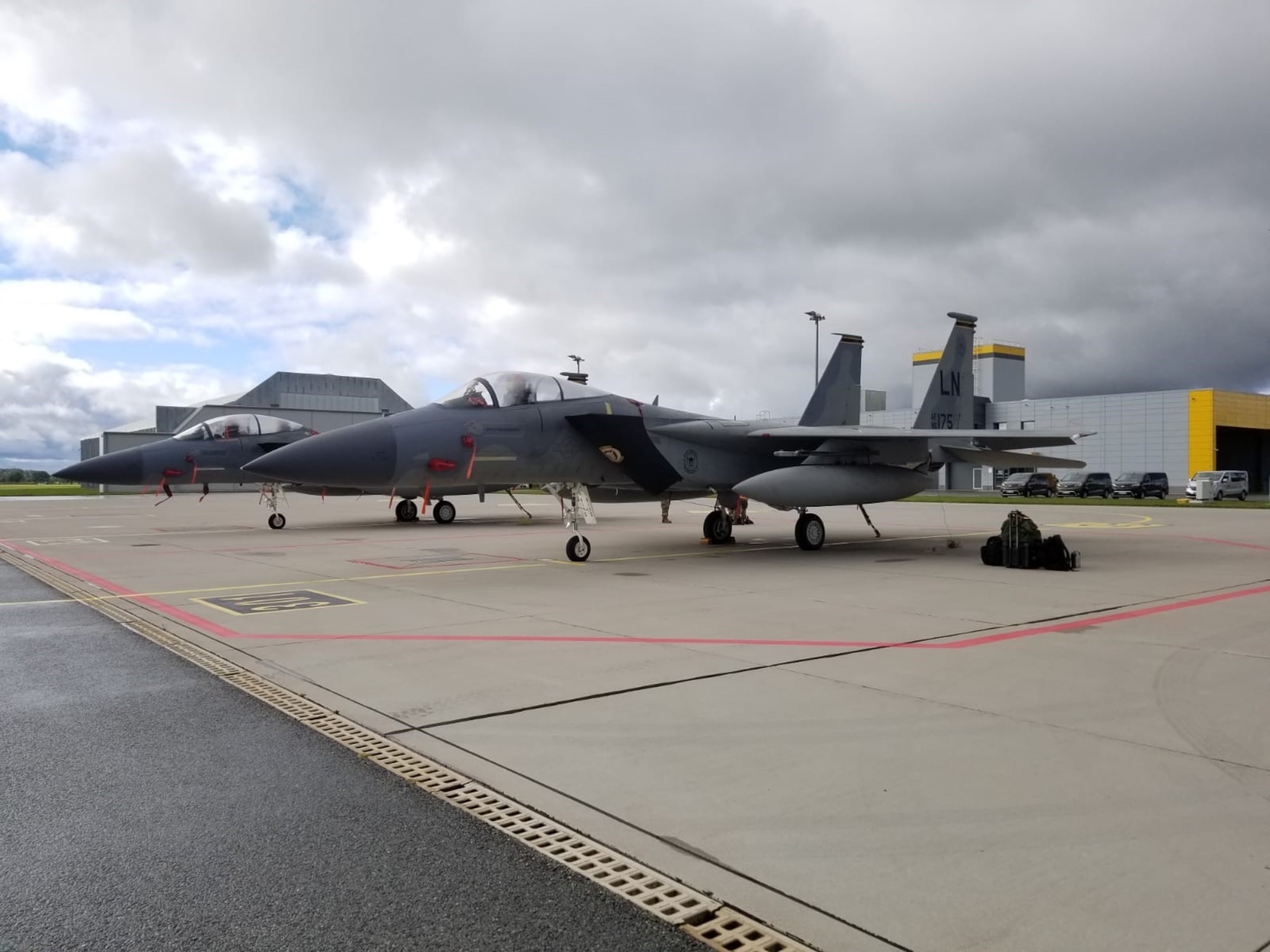 Two U.S. Air Force F-15 Eagle aircraft from Royal Air Force Lakenheath are parked at Lielvarde Air Base, Latvia during an instrument flight rules certification ceremony, September 2021.
