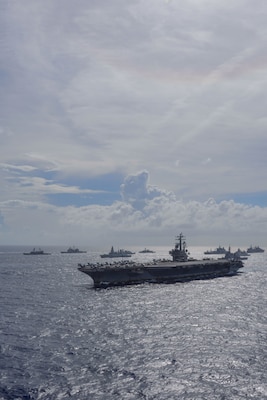 211003-N-RC359-1101 PHILIPPINE SEA (Oct. 3, 2021) The United Kingdom’s carrier strike group, led by HMS Queen Elizabeth (R 08), and the Japan Maritime Self-Defense Force (JMSDF), led by Hyuga-class helicopter destroyer JS Ise (DDH 182), joined with U.S. Navy carrier strike groups, led by flagships USS Ronald Reagan (CVN 76) and USS Carl Vinson (CVN 70), to conduct multiple carrier strike group operations in the Philippine Sea. The integrated at-sea operations brought together more than 15,000 Sailors across six nations, and demonstrates the U.S. Navy’s ability to work closely with its unmatched network of alliances and partnerships in support of a free and open Indo-Pacific. (U.S. Navy photo by Mass Communication Specialist Seaman George Cardenas)
