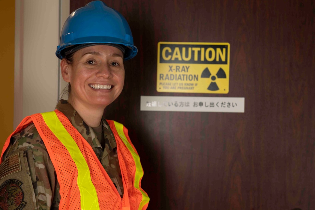 Lt. Col. Lisa Guzman, 374th Medical Support Squadron commander, stands in front of a computerized tomography room during an inspection at Yokota Air Base, Japan, Oct. 8, 2021.