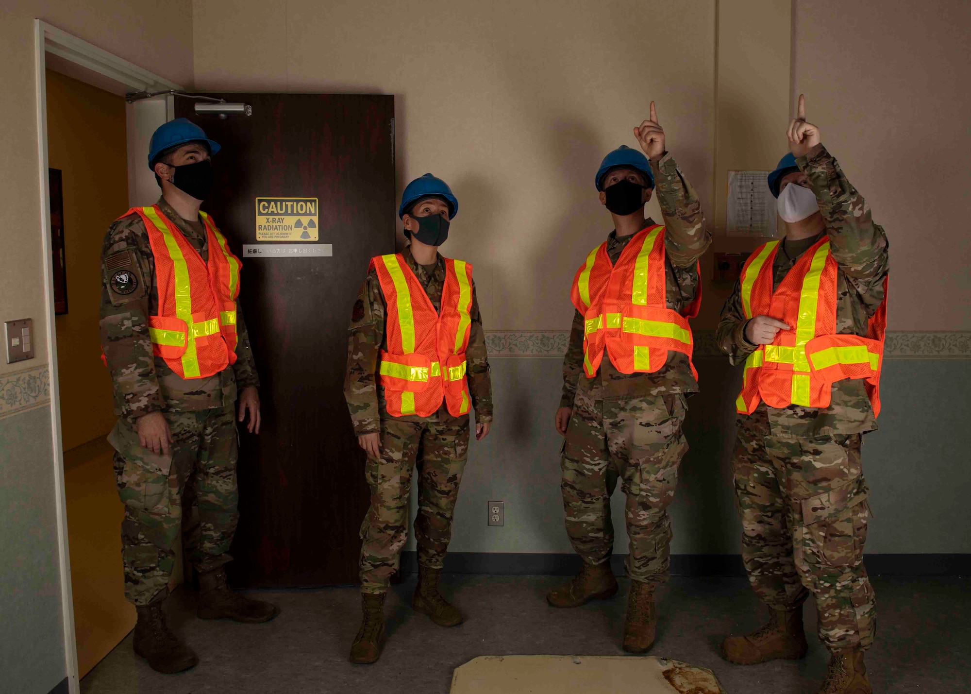 Lt. Col. Lisa Guzman, 374th Medical Support Squadron commander, left middle, inspects a computerized tomography room at Yokota Air Base, Japan, Oct. 8, 2021.