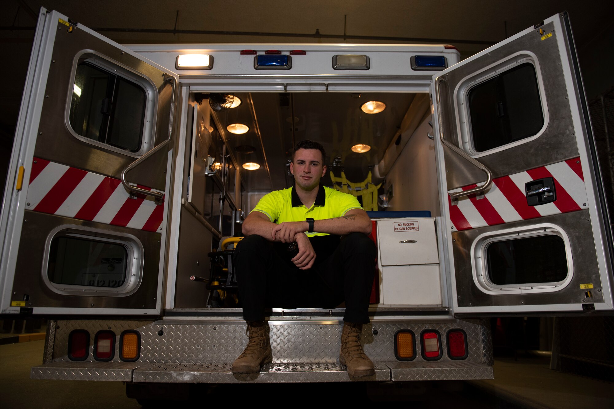 Airman sits in vehicle.