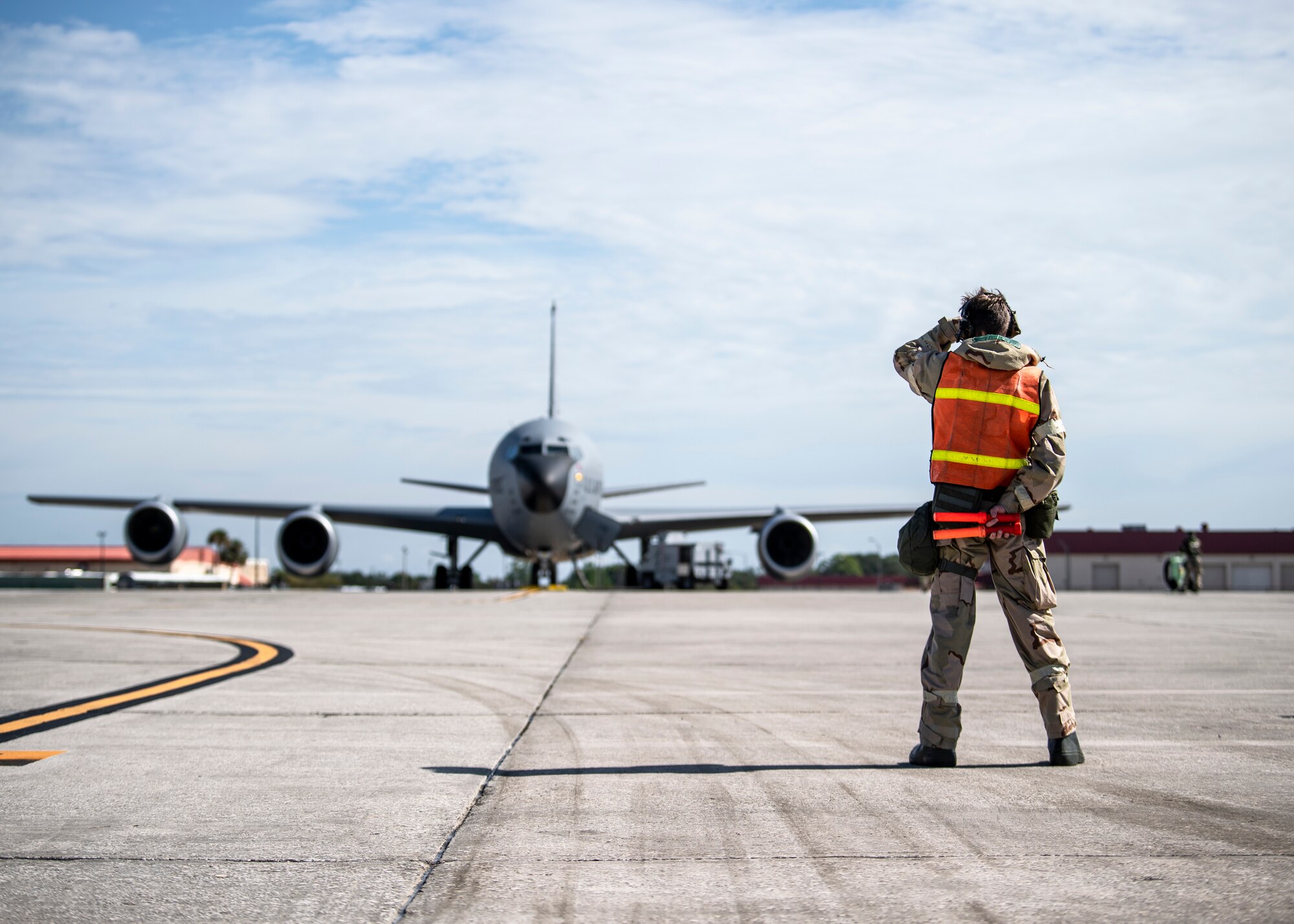 An Airman assigned to the 6th Air Refueling Wing marshals a KC-135 Stratotanker prior to departure at MacDill Air Force Base, Florida, Oct. 6, 2021.