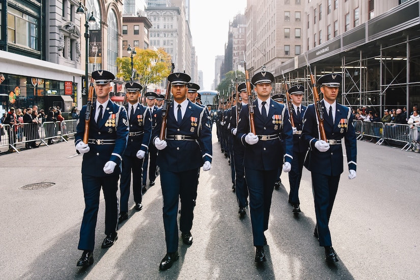 Airmen march during a parade.