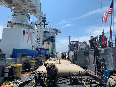 Marines from 8th Engineer Support Battalion, Bulk Fuel Company 1st Platoon transfer fuel from an off-shore vessel into collapsible fabric tanks aboard Assault Craft Unit Two landing craft utility 1662 as part of Large-Scale Exercise (LSE 2021), Aug. 8, 2021.