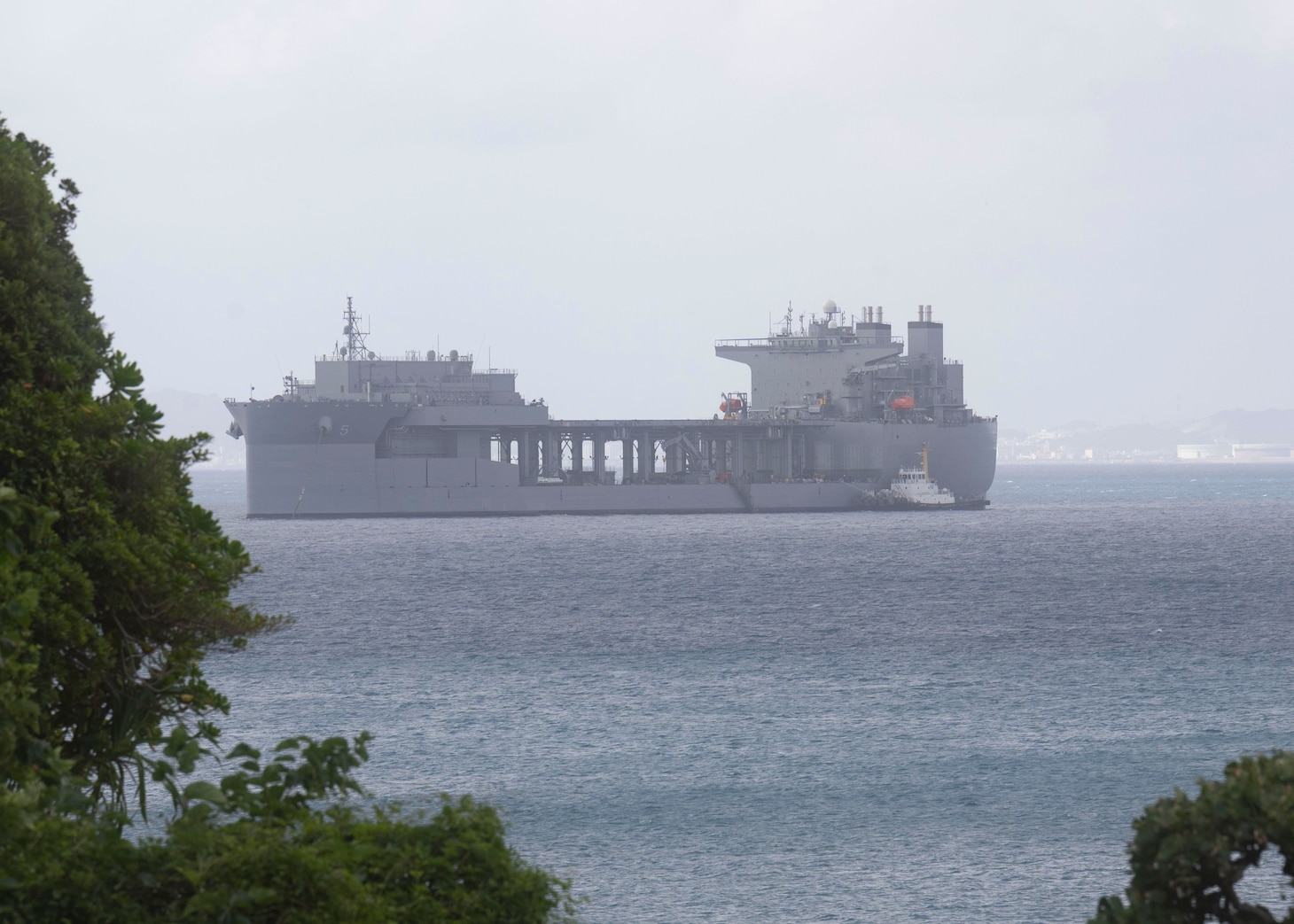 WHITE BEACH, Japan (Oct. 6, 2021) Lewis B. Puller-class expeditionary staging base USS Miguel Keith (ESB 5) anchors off Commander, Fleet Activities Okinawa White Beach Naval Facility Oct. 6, 2021. Miguel Keith, assigned to Amphibious Squadron Eleven, is operating in the U.S. 7th Fleet area of responsibility to enhance interoperability with allies and partners and serve as a ready response force to defend peace and stability in the Indo-Pacific region (U.S. Navy photo by Mass Communication Specialist 2nd Class Jessica Ann Hattell)