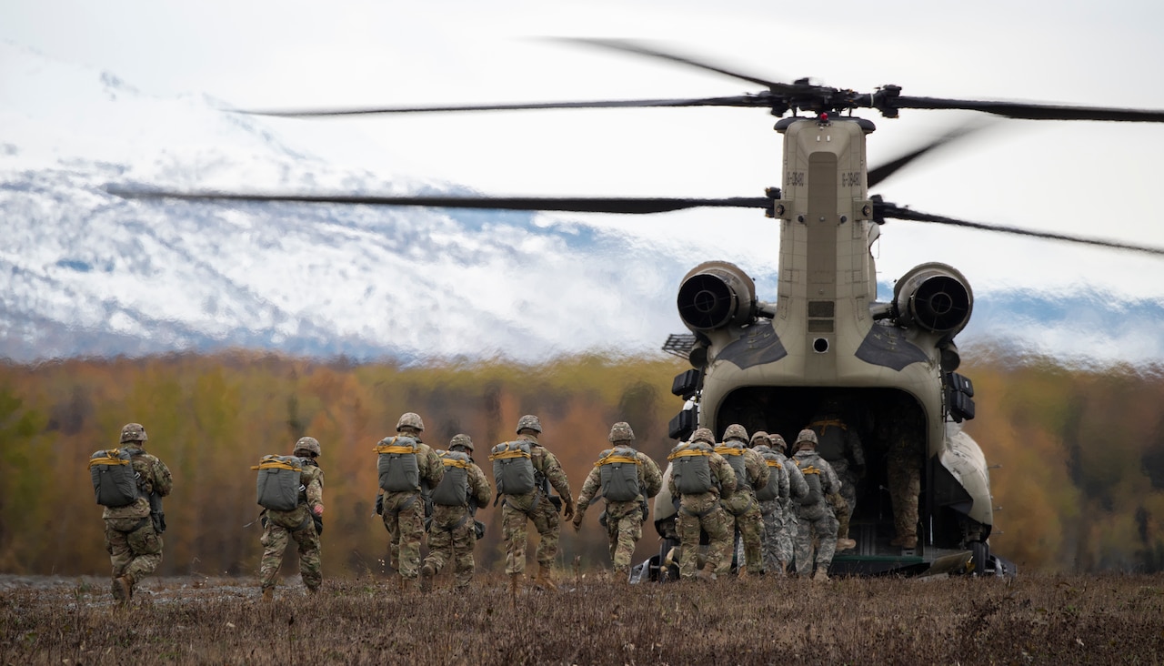 Soldiers board a helicopter.