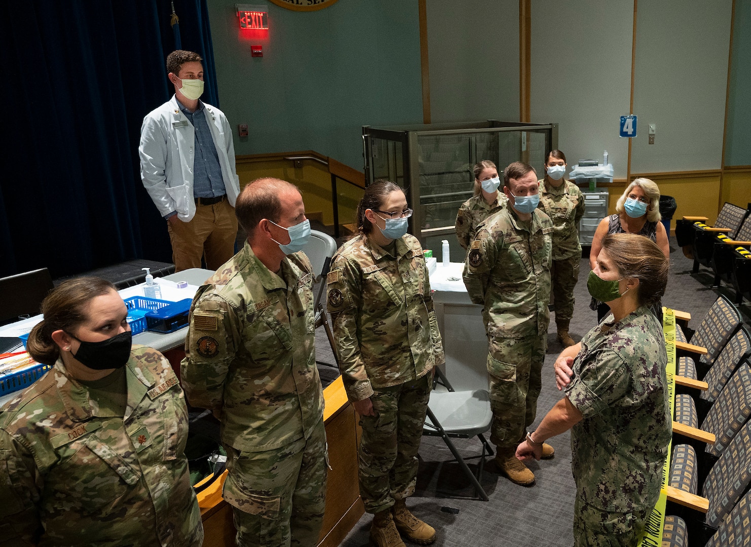 Rear Adm. Kristen Fabry (right), Defense Logistics Agency Land and Maritime commander, visits with a team of 88th Medical Group Airmen during a visit Oct. 1, 2021, to the Medical Center at Wright-Patterson Air Force Base, Ohio. The team traveled to Columbus earlier this year to provide COVID-19 vaccines to personnel in Fabry’s command, and she wanted to personally thank them. (U.S. Air Force photo by R.J. Oriez)