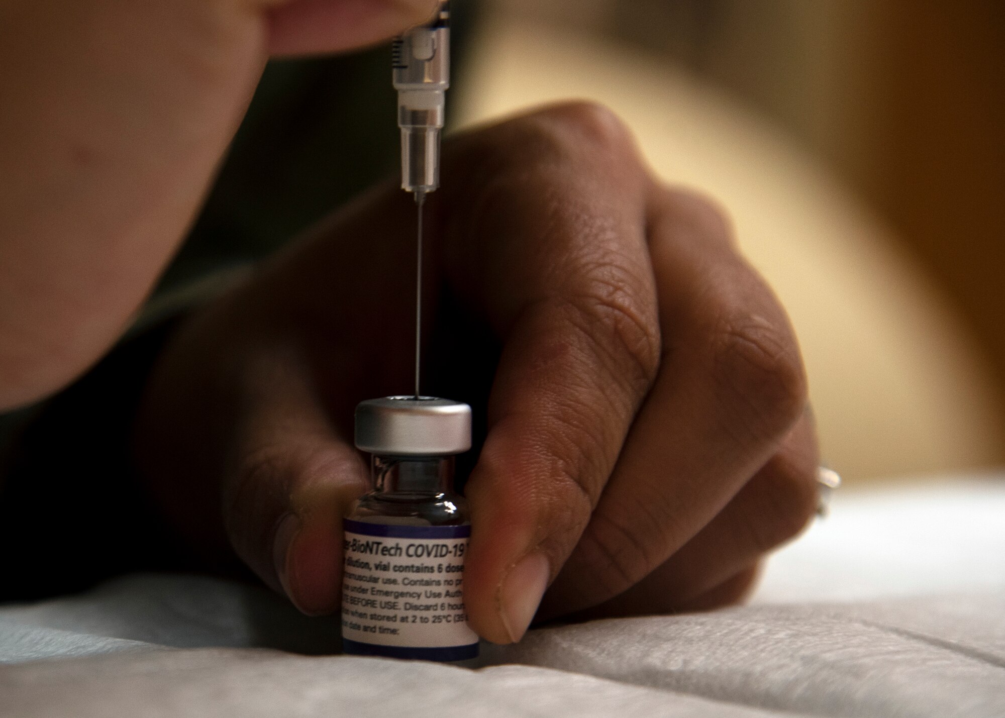 Senior Airman Sara Sanchez from the 6th Health Care Operations Squadron prepares a COVID-19 vaccine for distribution at MacDill Air Force Base, Florida, Sept. 30, 2021.