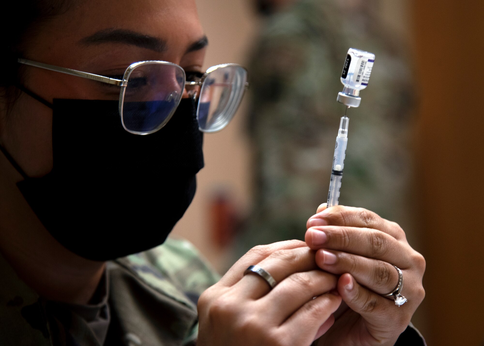 Senior Airman Sara Sanchez from the 6th Health Care Operations Squadron prepares a COVID-19 vaccine for distribution at MacDill Air Force Base, Florida, Sept. 30, 2021.