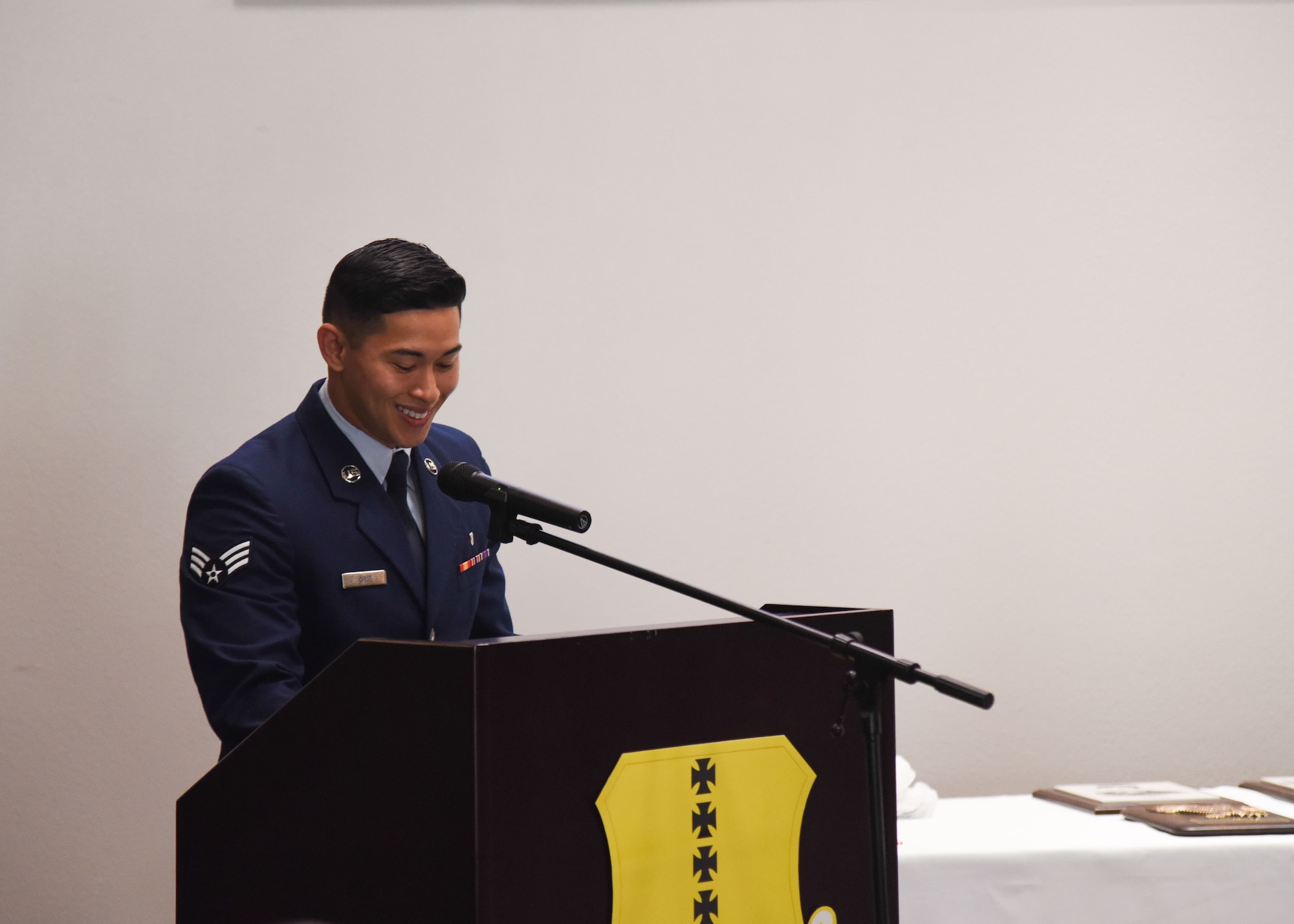 U.S. Air Force Senior Airman Jude Cruz, 47th Operations Support Squadron aerospace physiology technician, at Laughlin Air Force Base, Texas, speaks during their ALS graduation ceremony on Goodfellow Air Force Base, Texas, Oct. 8, 2021. Cruz talked about the importance of doing what is right at all times and finding ways to motivate subordinates. (U.S. Air Force photo by Staff Sgt. Tyrell Hall)