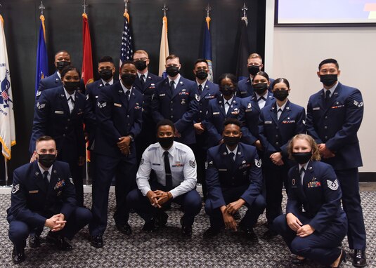 Graduates of Airman Leadership School Class 21-G pose for a group picture during the ALS graduation ceremony on Goodfellow Air Force Base, Texas, Oct. 8, 2021. ALS focuses on developing leadership abilities, the profession of arms and building effective communication. (U.S. Air Force photo by Staff Sgt. Tyrell Hall)