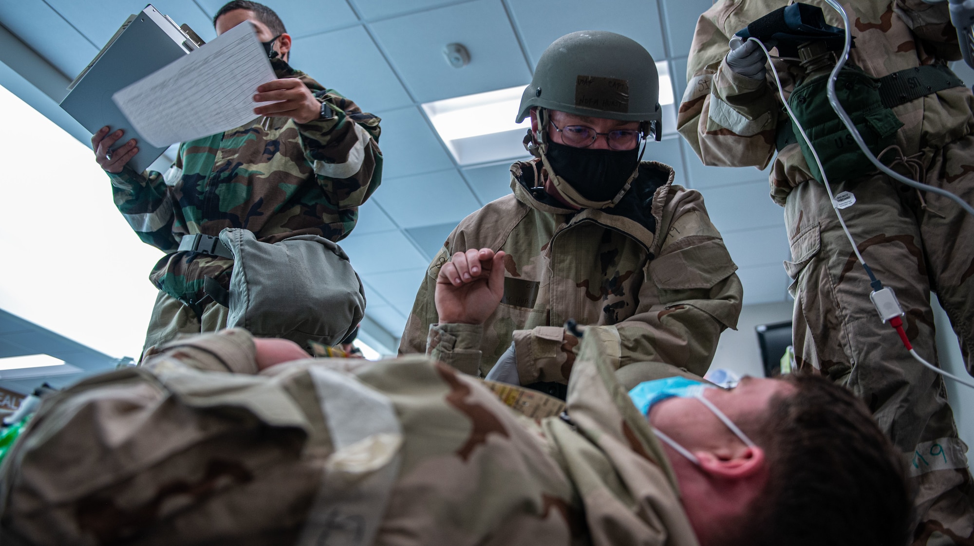 Medical Airmen perform simulated triage on a patient