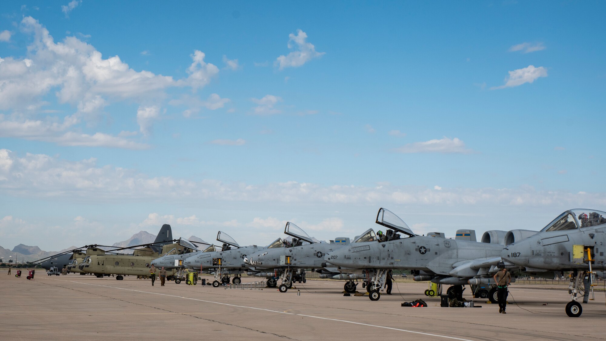 Multiple aircraft sit on the flight line.