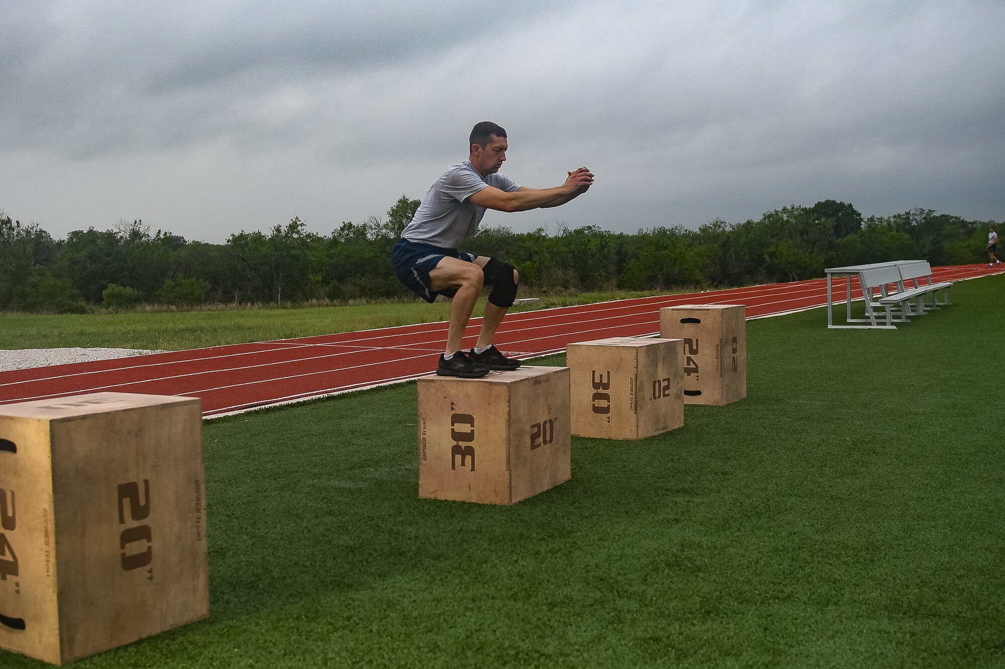 Airman performs box jump exercises.