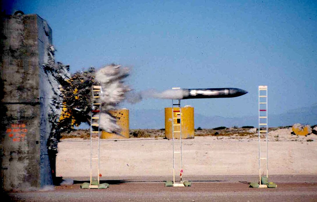 A payload penetrates a concrete target during impact testing at the Holloman High Speed Test Track at Holloman Air Force Base, New Mexico. The HHSTT is operated by the 846th Test Squadron, a unit of the 704th Test Group of the Arnold Engineering Development Complex, headquartered at Arnold Air Force Base, Tenn. Personnel in the 846 TS are currently exploring the modernization of test track to extend its lifespan and further aid in the development of hypersonic systems. (U.S. Air Force photo)